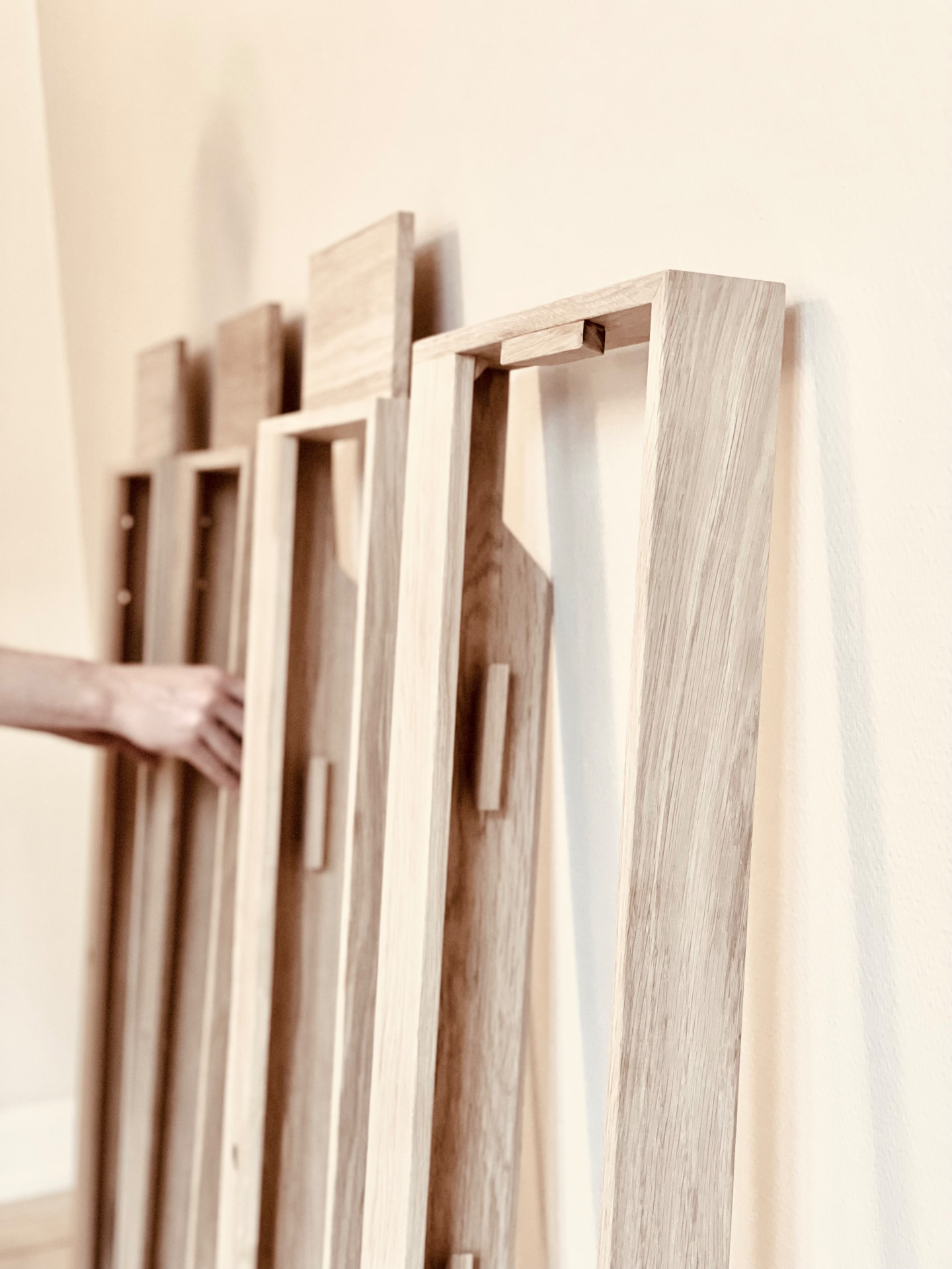 Handcrafted solid oak piano frames lined up ready for shipping in the Danish workshop